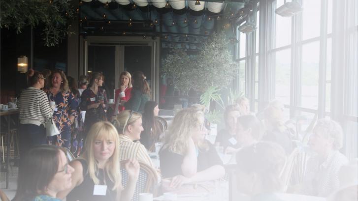 A large crowd of women networking at a previous OxLEP Business 'Women in Business' gathering